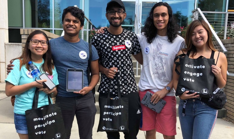 A group of young asian voters outside their polling place