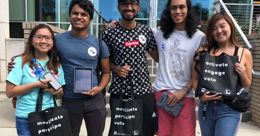 A group of young asian voters outside their polling place